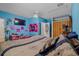 Bedroom featuring neutral walls, ceiling fan, and closet at 8525 N Ola Ave, Tampa, FL 33604