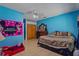 Bright bedroom with tile flooring, ceiling fan, and closet at 8525 N Ola Ave, Tampa, FL 33604