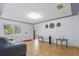 Spacious living room with tile flooring, bright walls, front door, and natural light at 8525 N Ola Ave, Tampa, FL 33604