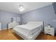 Bright bedroom with hardwood floors, fan and lots of space at 8525 N Ola Ave, Tampa, FL 33604