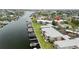 An aerial view of waterfront condos and a boat dock on a sunny day at 1028 Apollo Beach Blvd # 203, Apollo Beach, FL 33572