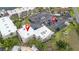 An aerial view of condos, a parking lot, and surrounding palm trees at 1028 Apollo Beach Blvd # 203, Apollo Beach, FL 33572