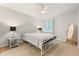 Cozy bedroom with neutral walls, carpet, a window for natural light, and simple decor at 1028 Apollo Beach Blvd # 203, Apollo Beach, FL 33572