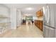 Open kitchen features stainless appliances and access to living room at 1028 Apollo Beach Blvd # 203, Apollo Beach, FL 33572