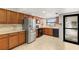 Bright kitchen features stainless steel appliances and tiled floors at 1028 Apollo Beach Blvd # 203, Apollo Beach, FL 33572
