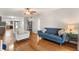 Open living room boasts hardwood floors, modern furniture, and open layout at 1028 Apollo Beach Blvd # 203, Apollo Beach, FL 33572