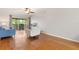 Relaxing living room showcases hardwood floors and ample natural light at 1028 Apollo Beach Blvd # 203, Apollo Beach, FL 33572