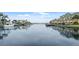 A view of the canal lined with homes and boats under a blue sky at 1028 Apollo Beach Blvd # 203, Apollo Beach, FL 33572