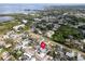 Aerial view of home in a residential area near the coast, showcasing lush foliage and neighborhood layout at 1102 Goshen Rd, Tarpon Springs, FL 34689
