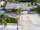 An aerial shot showcasing the home's layout, landscaping, and neighborhood at 1102 Goshen Rd, Tarpon Springs, FL 34689