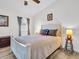 Inviting bedroom featuring a ceiling fan, neutral colors, and wood-look flooring at 1102 Goshen Rd, Tarpon Springs, FL 34689