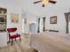 Comfortable bedroom with a window offering natural light and an adjacent sitting area at 1102 Goshen Rd, Tarpon Springs, FL 34689