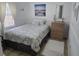 Bright bedroom features wood floors, closet, chair, and natural light at 1102 Goshen Rd, Tarpon Springs, FL 34689