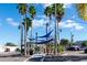 Downtown street view of Tarpon Springs with palm trees, blue canopies, and benches at 1102 Goshen Rd, Tarpon Springs, FL 34689