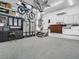 Garage with ample storage, epoxy floor, and bikes hanging from the ceiling at 1102 Goshen Rd, Tarpon Springs, FL 34689