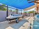 Jet ski on a trailer parked under blue shade at 1102 Goshen Rd, Tarpon Springs, FL 34689