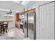 Bright kitchen with stainless steel appliances, ample storage, and a view into the adjacent dining area at 1102 Goshen Rd, Tarpon Springs, FL 34689
