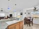 Bright kitchen featuring stainless steel appliances, a large island, and a cozy breakfast nook with backyard views at 1102 Goshen Rd, Tarpon Springs, FL 34689