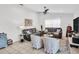 Bright living room with comfortable seating, neutral tones, and a ceiling fan for added comfort at 1102 Goshen Rd, Tarpon Springs, FL 34689