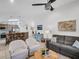 Open-concept space showing the kitchen and living room with comfortable seating and modern decor at 1102 Goshen Rd, Tarpon Springs, FL 34689