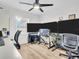 Office setup featuring multiple monitors, ceiling fan and desk at 1102 Goshen Rd, Tarpon Springs, FL 34689