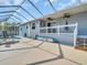 Spacious screened-in lanai overlooking the pool, ideal for relaxation and outdoor entertaining at 1102 Goshen Rd, Tarpon Springs, FL 34689