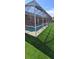 Aerial view of screened-in pool with artificial turf at 1102 Goshen Rd, Tarpon Springs, FL 34689