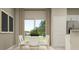 Dining room features a modern table, view to the yard, and decor at 11084 E 65Th Ter, Palmetto, FL 34221