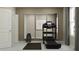 Bright exercise room with treadmill, weight rack, mirrors and natural light at 11084 E 65Th Ter, Palmetto, FL 34221
