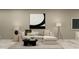 Bright living room features a modern sofa, decor, and overhead lighting at 11084 E 65Th Ter, Palmetto, FL 34221