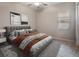 Well-lit bedroom featuring neutral walls, ceiling fan and gray carpet at 11714 Sunburst Marble Rd, Riverview, FL 33579