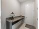 Hallway features a decorative counter and dark wood cabinets at 11714 Sunburst Marble Rd, Riverview, FL 33579