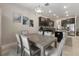 Elegant kitchen view showing stylish appliances and dining area with modern light fixture at 11714 Sunburst Marble Rd, Riverview, FL 33579