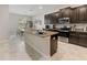 Spacious kitchen with an island, granite countertops, and stainless steel appliances at 11714 Sunburst Marble Rd, Riverview, FL 33579