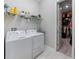 Laundry room features white washer/dryer and shelving above; walk-in closet at 11714 Sunburst Marble Rd, Riverview, FL 33579