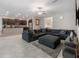 Inviting living room connected to kitchen featuring a sectional sofa and large TV at 11714 Sunburst Marble Rd, Riverview, FL 33579