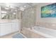 Bright bathroom with soaking tub, glass-enclosed shower, and modern vanity with ample space at 1325 Snell Isle Ne Blvd # 708, St Petersburg, FL 33704