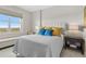 Bright, inviting bedroom featuring a large window, comfortable bed, and stylish decor at 1325 Snell Isle Ne Blvd # 708, St Petersburg, FL 33704