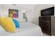 Cozy bedroom features a comfortable bed, stylish decor, and en suite bathroom access at 1325 Snell Isle Ne Blvd # 708, St Petersburg, FL 33704
