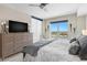 Comfortable bedroom showcasing water views, a dresser, and ample natural light for a relaxing ambiance at 1325 Snell Isle Ne Blvd # 708, St Petersburg, FL 33704