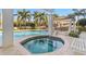 Relax in this in-ground hot tub with a view of the pool and grilling area at 1325 Snell Isle Ne Blvd # 708, St Petersburg, FL 33704