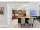 Well-equipped kitchen featuring stone counters, wood cabinetry, and seamless flow to the adjacent dining area at 1325 Snell Isle Ne Blvd # 708, St Petersburg, FL 33704
