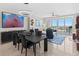 Bright living room with large windows, sleek furniture, and a scenic view from the dining area at 1325 Snell Isle Ne Blvd # 708, St Petersburg, FL 33704
