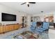 Inviting living room with modern furnishings, blue accents, and a ceiling fan for a bright and airy feel at 1325 Snell Isle Ne Blvd # 708, St Petersburg, FL 33704