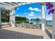 Relaxing outdoor patio with a fire pit and seating, set against a backdrop of waterfront views at 1325 Snell Isle Ne Blvd # 708, St Petersburg, FL 33704