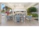 Covered patio with an outdoor bar, comfortable seating, and a pergola, perfect for gatherings at 1325 Snell Isle Ne Blvd # 708, St Petersburg, FL 33704