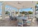Inviting covered patio with brick flooring, stylish seating, and waterfront views, perfect for relaxing and entertaining guests at 1325 Snell Isle Ne Blvd # 708, St Petersburg, FL 33704