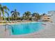 Enjoy this beautiful, shared, in-ground pool surrounded by palm trees and many chairs for residents to relax at 1325 Snell Isle Ne Blvd # 708, St Petersburg, FL 33704