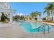 Enjoy this in-ground pool, with a fountain, and with a connected hot tub surrounded by palm trees at 1325 Snell Isle Ne Blvd # 708, St Petersburg, FL 33704