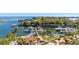 Scenic waterfront view of a marina filled with boats, surrounded by lush greenery and beautiful landscaping at 1325 Snell Isle Ne Blvd # 708, St Petersburg, FL 33704